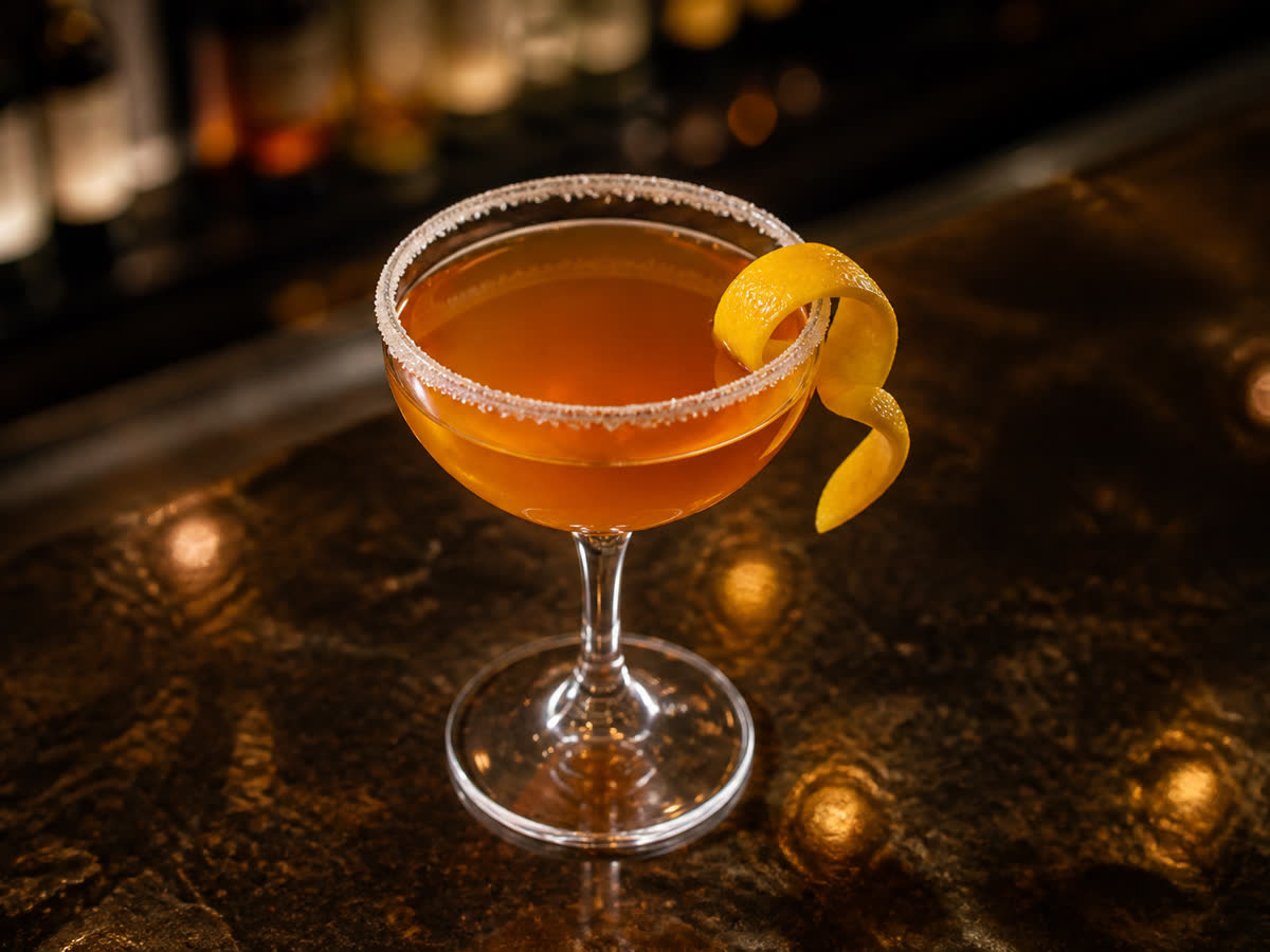 Brandy Crusta cocktail in a coupe — Lemon juice