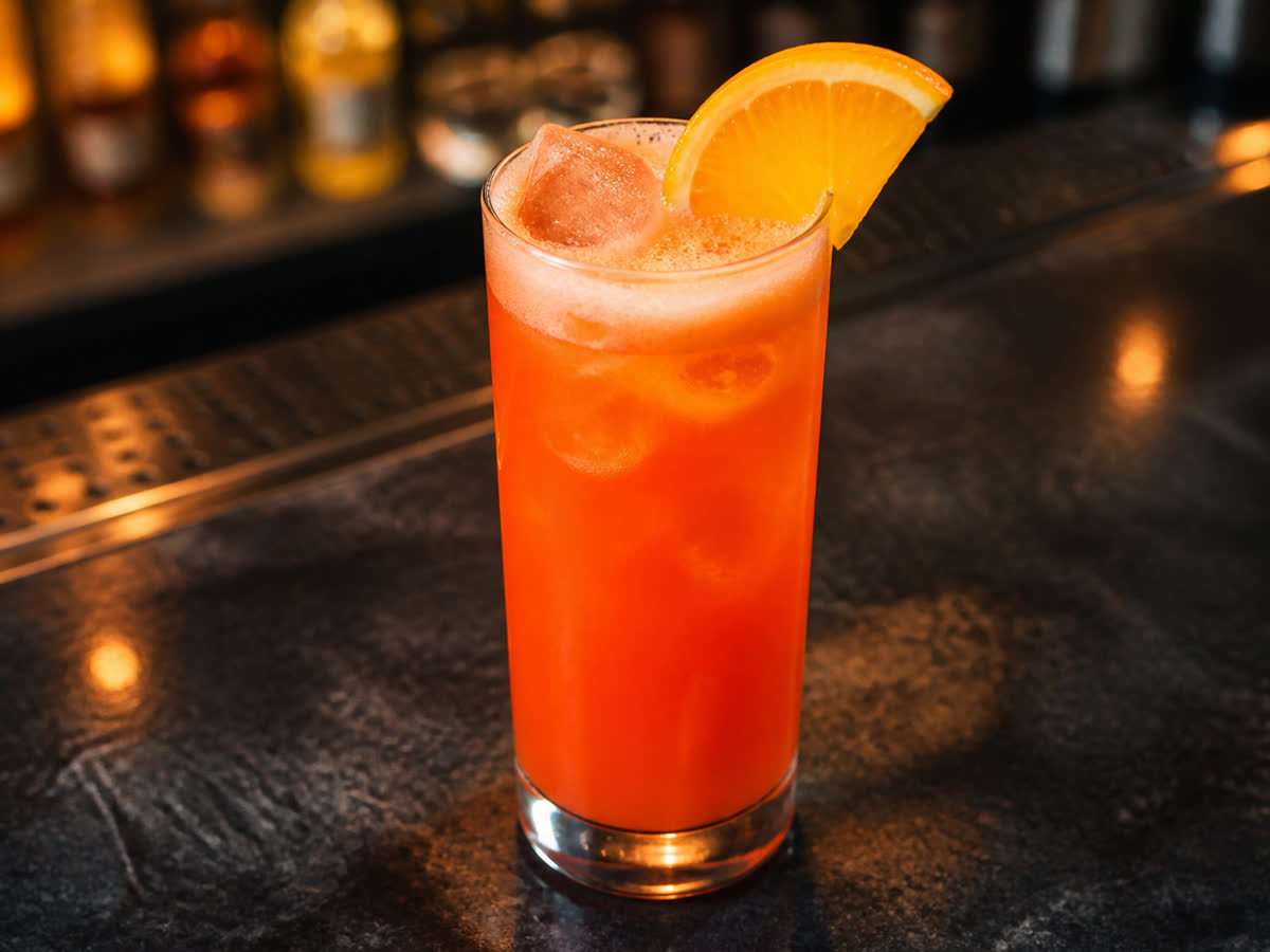 Garibaldi cocktail in a highball glass — Orange juice